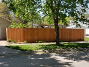 6' wood solid privacy fence with pre-stained pickets. 