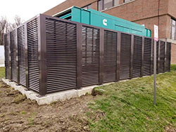 Kearney fence company Nebraska commercial fence contractors architectural mechanical screening screen louvered semi private private solid staggered board on board shadow box alternating industrial louvers rooftop louvers chillers generators truck wells outside storage condensors rooftop equipment patios trash dumpsters transformers HVAC courtyards pool equipment fence aluminum galvanized steel degree of openness direct visibility standalone wall louvers