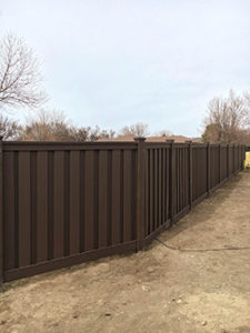 Kearney fence company Nebraska board on board shadow box picket alternating staggered wood vinyl bufftech enduris plygem bufftech tan sandstone white sandstone khaki cracking chipping splitting UVB residential backyard perimeter security visibility